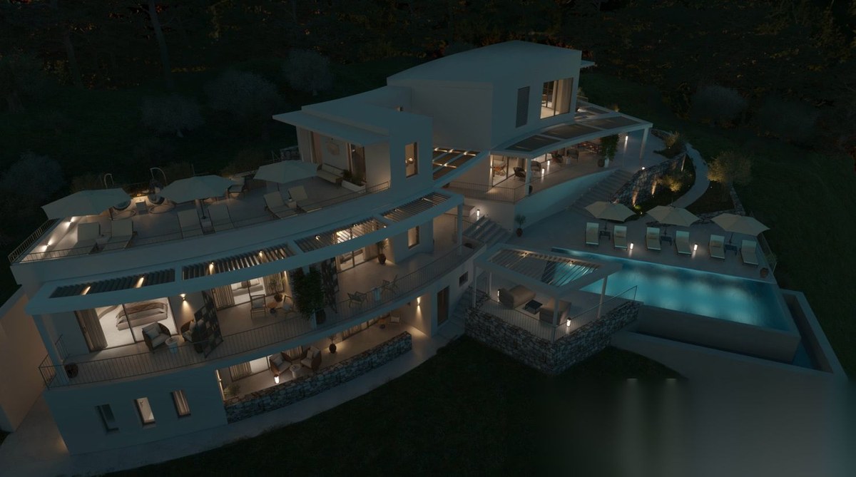 Aerial view of the luxury hillside villa and curved terraces at dusk in Sithonia, Halkidiki, Greece