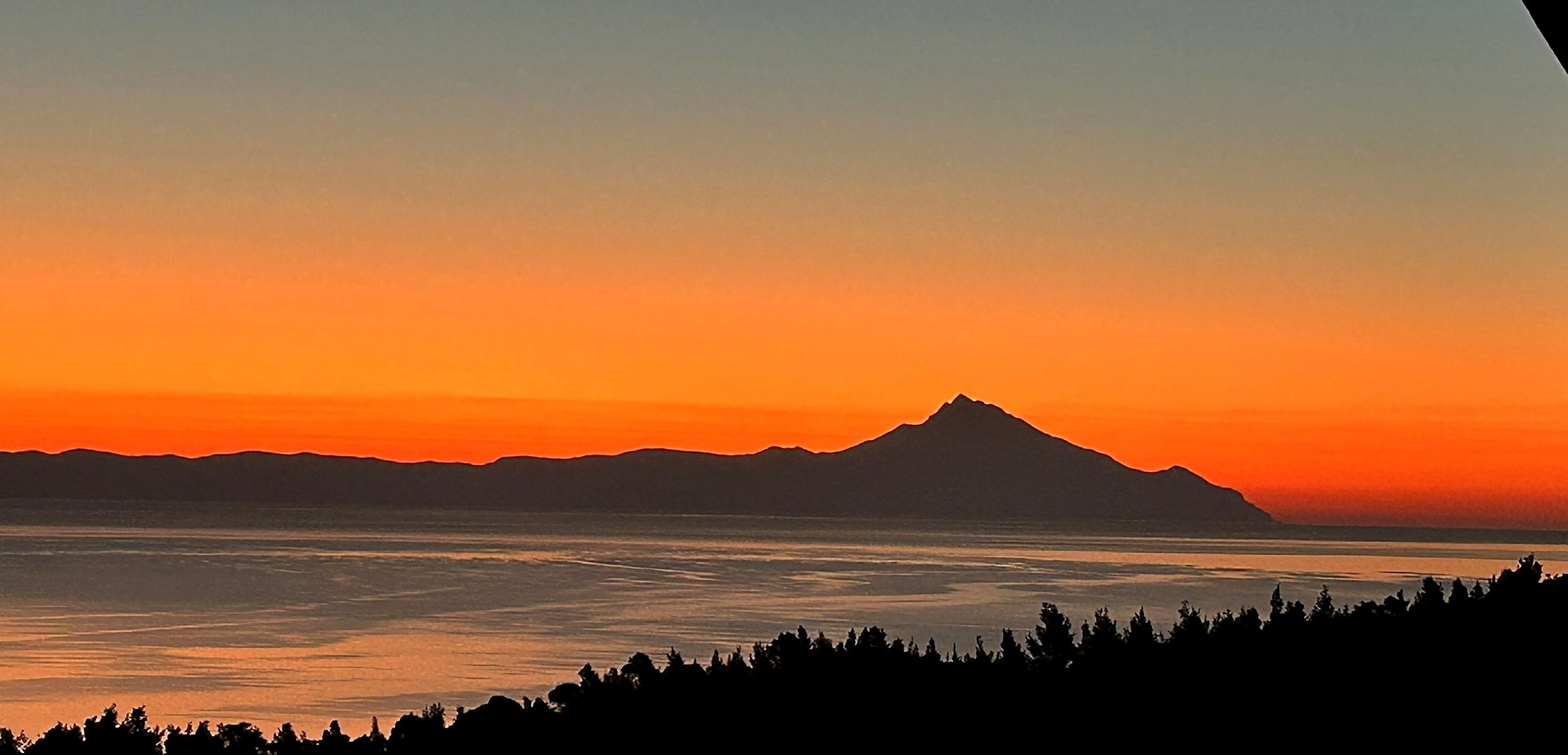 Sunrise over Mount Athos seen from the villa — the Aegean and the Sithonia coast at first light